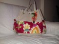 Cartera tropical Bs.F 550